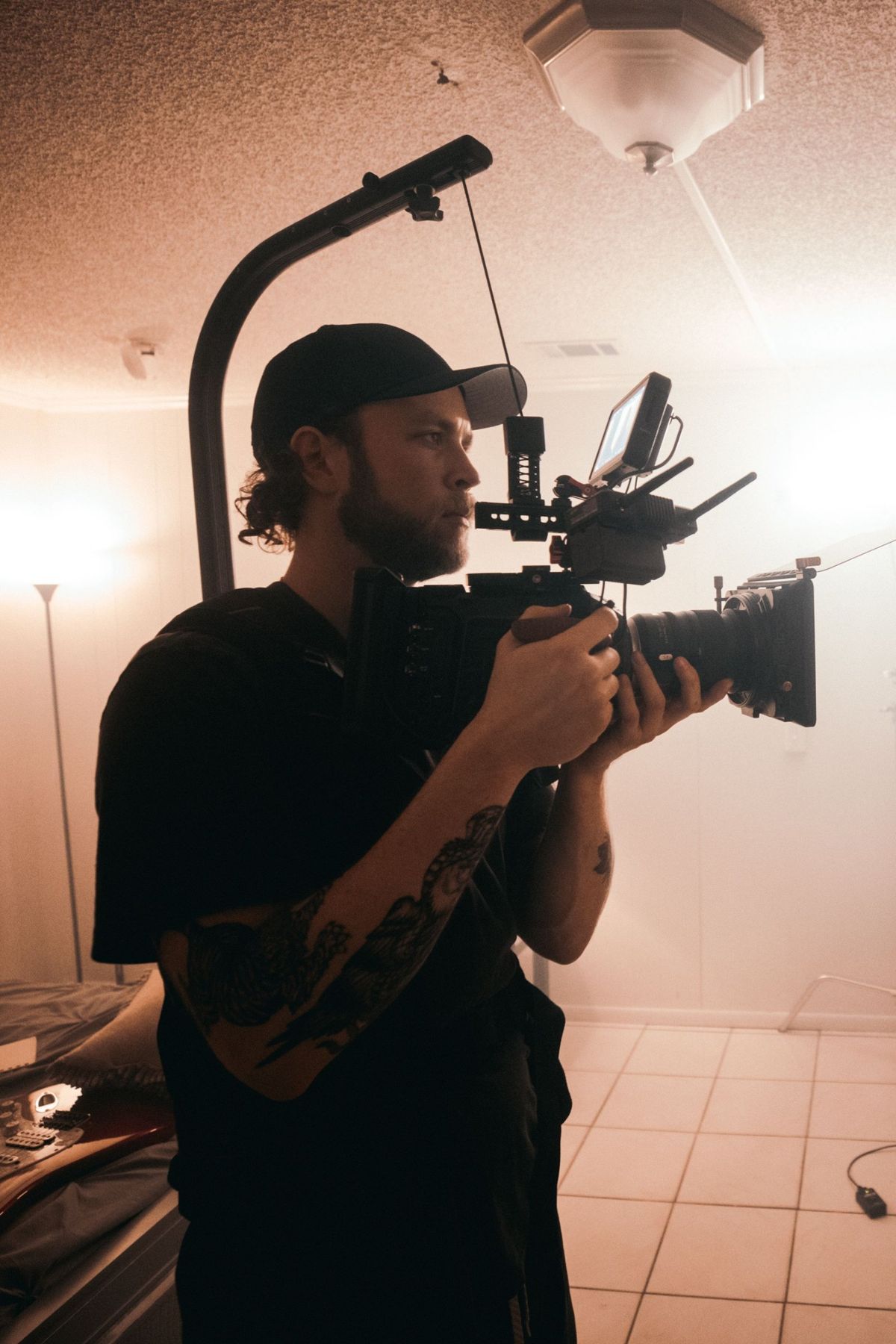 Camera operator in a hazy, backlit room