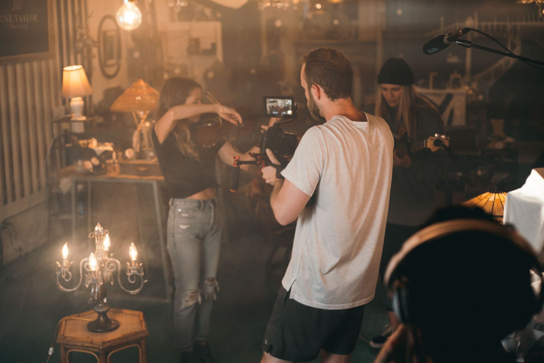 Music video shoot with a violinist on a smoky set